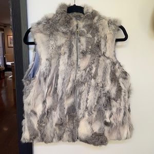 100% authentic rabbit fur vest . Grey and white with zipper. One size.